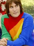 Noel-Fielding-Great-British-Bake-Off-Rainbow-Sweater-1.webp