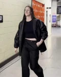 Caitlin-Clark-2025-WNBA-Playoffs-Semifinal-Black-Leather-Jacket.webp