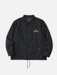 White-Mountaineering-Qotsa-Lullabies-To-Paralyze-Coach-Jacket.webp