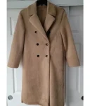 A-Merry-Little-Ex-Mas-2025-Alicia-Silverstone-Coat1.webp